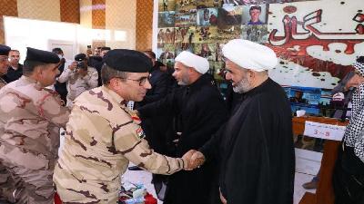 وفد العتبة الحسينية  يشارك في الحفل التأبيني لأحياء الذكرى الثامنة لشهداء سنجار